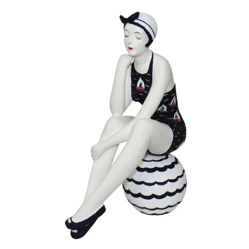 Bathing Beauty Figurine in Navy Blue Swimsuit with Sail Boat Accents Sitting on Beach Ball Classic Sporty Swimsuit