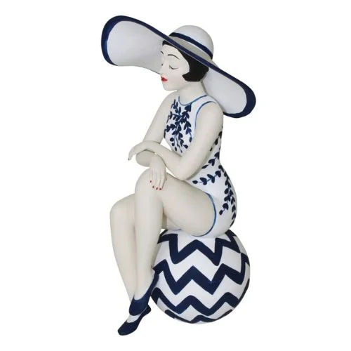At the Beach Bathing Beauty Figurine in White and Navy Swimsuit with Large Sun Hat - Medium Bather Statue Sitting on Beach Ball Deep-V Swimsuit Design